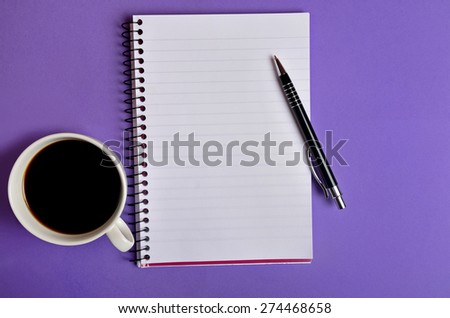 Empty notebook on purple background