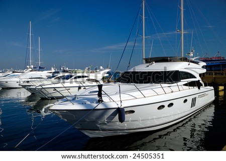 White yachts on an anchor in harbour