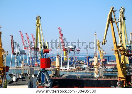 View on trading seaport with cranes, cargoes and the ship
