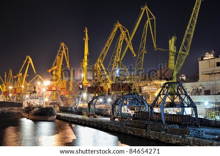 night view of the industrial port with cargoes and ship