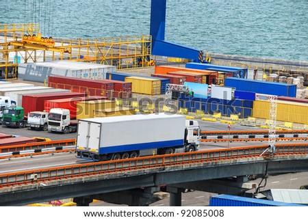 truck carries container to a warehouse near the sea