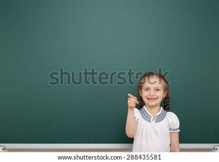 Schoolgirl near the school board