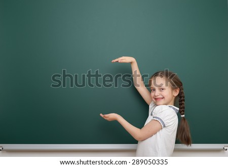 Schoolgirl near the school board