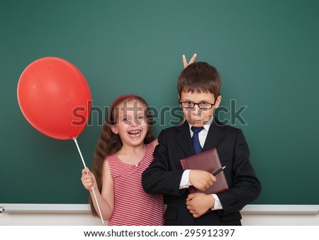 boy and girl near the school board