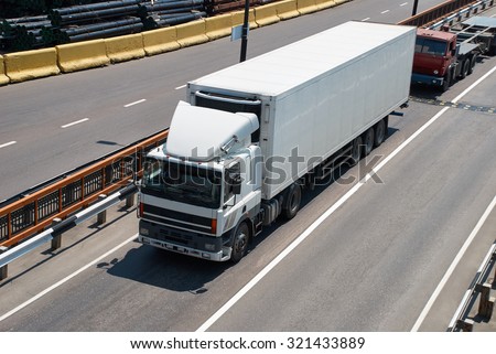 White truck on road. Cargo transportation