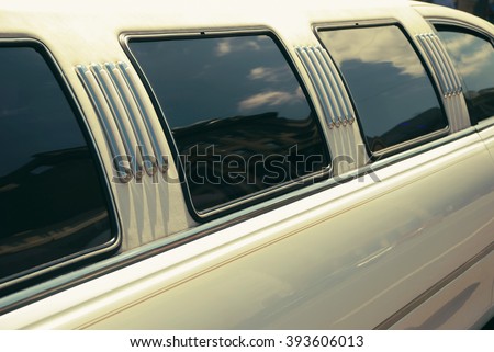 White wedding limousine long side view with windows