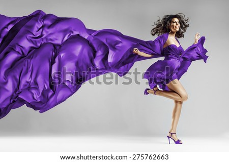 Woman in violet waving dress with flying fabric This photo has cut contours Dress! (in Photoshop)