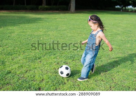 Girls play soccer