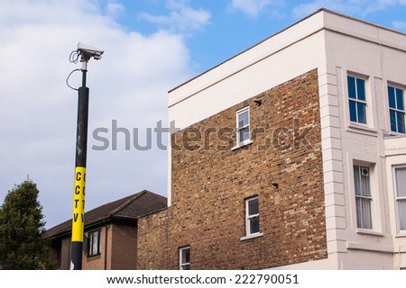 CCTV camera on a pole monitoring an high security mansion.