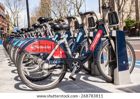 London, UK - April 12 2015: Detail of Boris bikes in line.  On 27 February 2015, Mayor Boris Johnson announces Santander as new Cycle Hire sponsor which will replace Barclays bank.