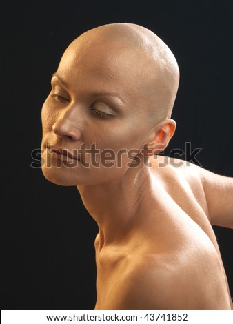 stock photo Portrait of the bald woman on a black background with the 