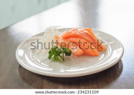 Salmon sashimi in dish on the table, slide salmon fish
