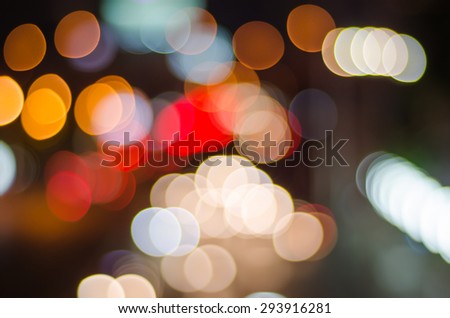 Night traffic and lights bokeh of car on road in city
