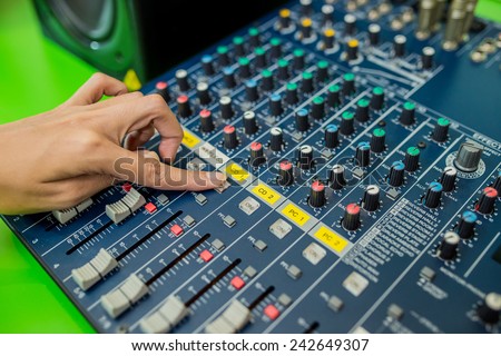 sound mixer in action, hand
