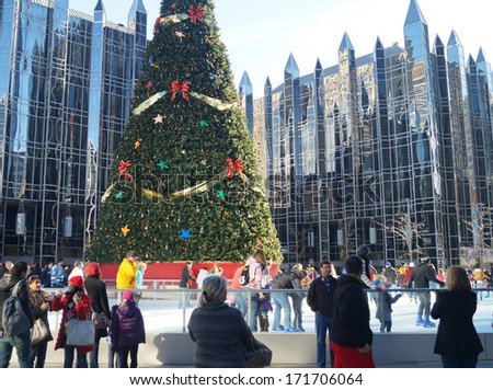 PITTSBURGH, PENNSYLVANIA - December 28, 2013:  Outdoor Ice Skating Rink in the City. People line up to skate at the outdoor ice rink at PPG Place in downtown Pittsburgh.