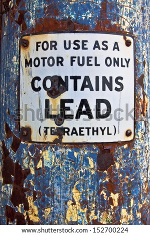 This early 1900\'s fuel pump has a warning sign saying for use as a motor fuel only because contains lead.