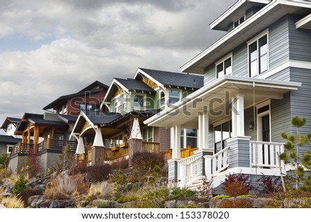 The new houses have a retro look to a past time located on a hillside.