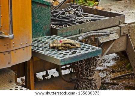 The log truck has cables and chains to use as needed. The gloves are used to protect the driverÃ¢Â?Â?s hands.