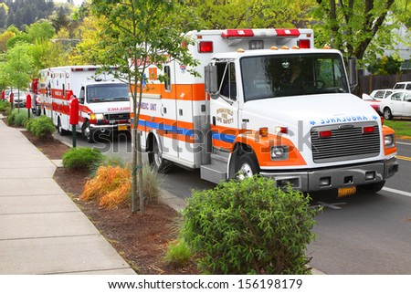 Eugene, Oregon, USA  May 2, 2012: In the urban town of Eugene, OR the local Emergency Services work together in a disaster response drill. These ambulances are lined up to move the injured.