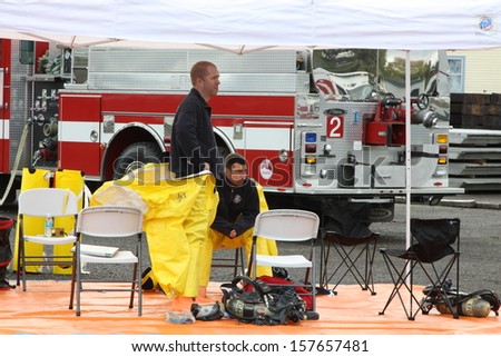 EUGENE, OREGON, USA November 3, 2011: Eugene Fire departments & emergency teams conduct disaster drills. This HAZMAT team is waiting with PPE to protect them from hazardous materials.