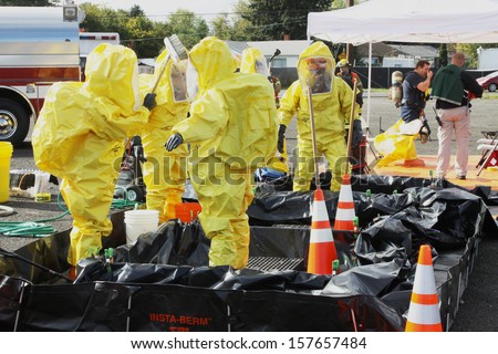 Eugene, Oregon, Usa Â?Â? November 3, 2011: Eugene Fire Departments And Emergency Response Teams Will Conduct Disaster Preparedness Drills. The Hazmat Teams Are Going Through Decontamination Washes.