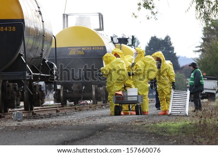 EUGENE, OREGON , USA  November 3, 2011: Eugene fire departments and emergency teams conduct disaster drills. The HAZMAT team is suited with protective suits to protect them from hazardous materials.
