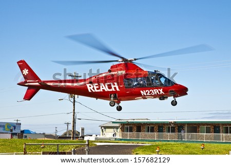 NEWPORT, OREGON, USA Â?Â? July 23, 2012: In coastal Newport, OR medical personnel boarded the helicopter and the pilot has taken off and flying away to transport the patient to another medical facility.