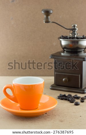 coffee cup with wooden manul coffee grinder