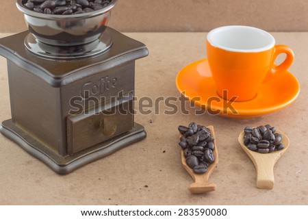 coffee cup with wooden manul coffee grinder