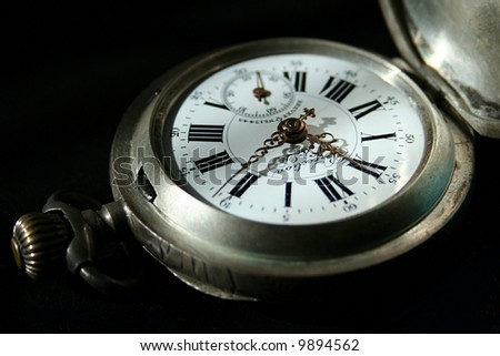 An old watch with black background