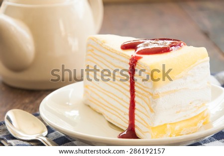 Strawberry cheese cake on wood table.