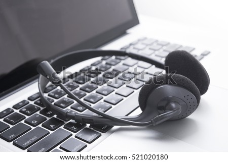 headset and computer laptop, call center support and customer service help, concept for communication