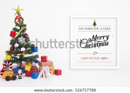 Christmas decorative with gift box and snowflake on christmas tree and Merry Christmas and Happy New Year 2017 text on white background.