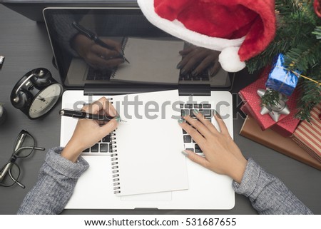 business woman hand writing Plan 2017 on note book. concept office christmas and happy new year to do list 2017.