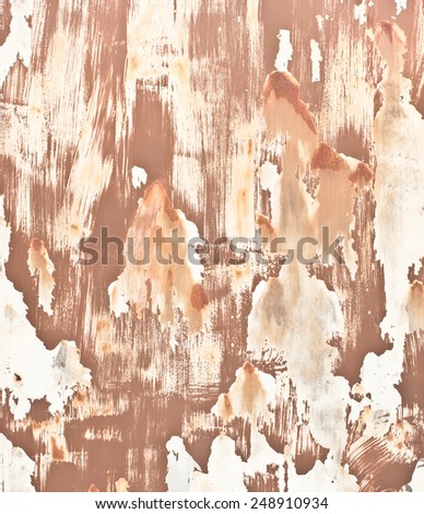 Multi color paint stripped background with rusted areas.