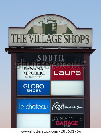 DARTMOUTH, CANADA - MAY 21, 2015: The Village Shops Sign at daybreak. The Village Shops is a collection of retail outlets located at Dartmouth Crossing, Nova Scotia.