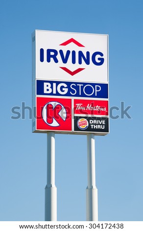 ENFIELD, CANADA - AUGUST 07, 2015: Irving Oil And Big Stop Sign. Irving Oil Ltd. is an energy producing and exporting company, including gasoline, oil, and natural gas.