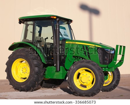 TRURO, CANADA - NOVEMBER 08, 2015: John Deere tractor display. John Deere is an American company manufacturing heavy industrial and lawn care equipment.