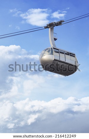 Portland aerial tram for public transportation to Oregon Health and Science University on a cloudy sky