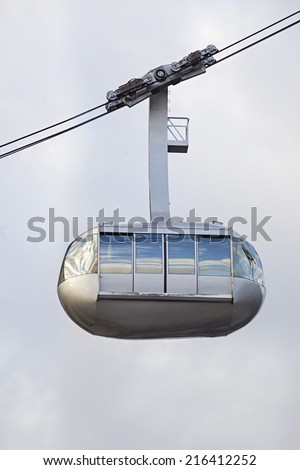 Portland aerial tram for public transportation to Oregon Health and Science University on a light background