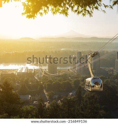 Aerial tram in Portland, Oregon transporting people to and from the hilltop where is also Oregon Health and Science University (OHSU) and a beautiful view on mount Hood and mount st. Helens