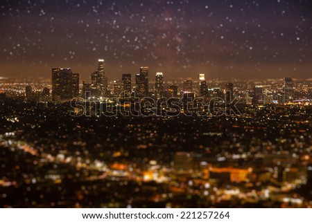 Tilt-shift of Downtown Los angeles cityscape in early night with glowing stars on the sky.