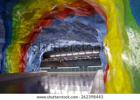 STOCKHOLM, SWEDEN â?? SEPTEMBER 25, 2014: Empty underground metro station with rainbow design painting in Stockholm, Sweden dedicated to olympic games in Sweden.
