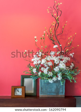 Pink Modern Interior Wall With Artificial Flowers In Ceramic Vase