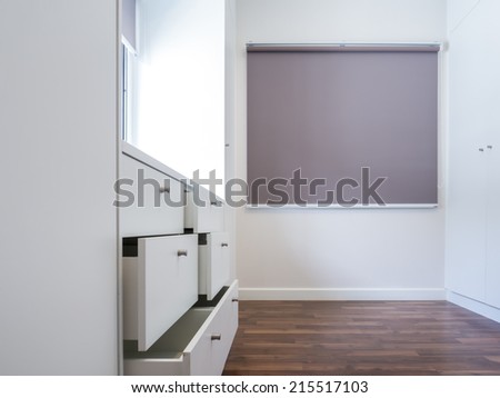 Modern apartment interior with walk in wardrobe