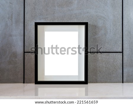 Modern interior wall background with blank black picture frame