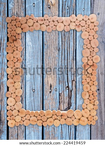Blank artificial picture frame isolated on abstract rustic wood texture background