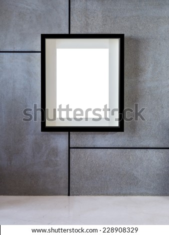 Blank black hanging picture frame on modern wall, background
