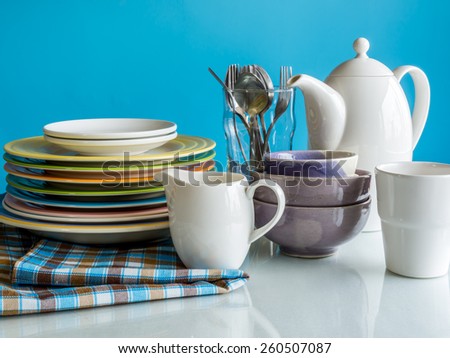 Colorful dishware utensil on table top/ interior of Dining room still life
