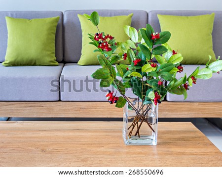 Flower vase on table-top with sofa/ minimalist modern interior Living room